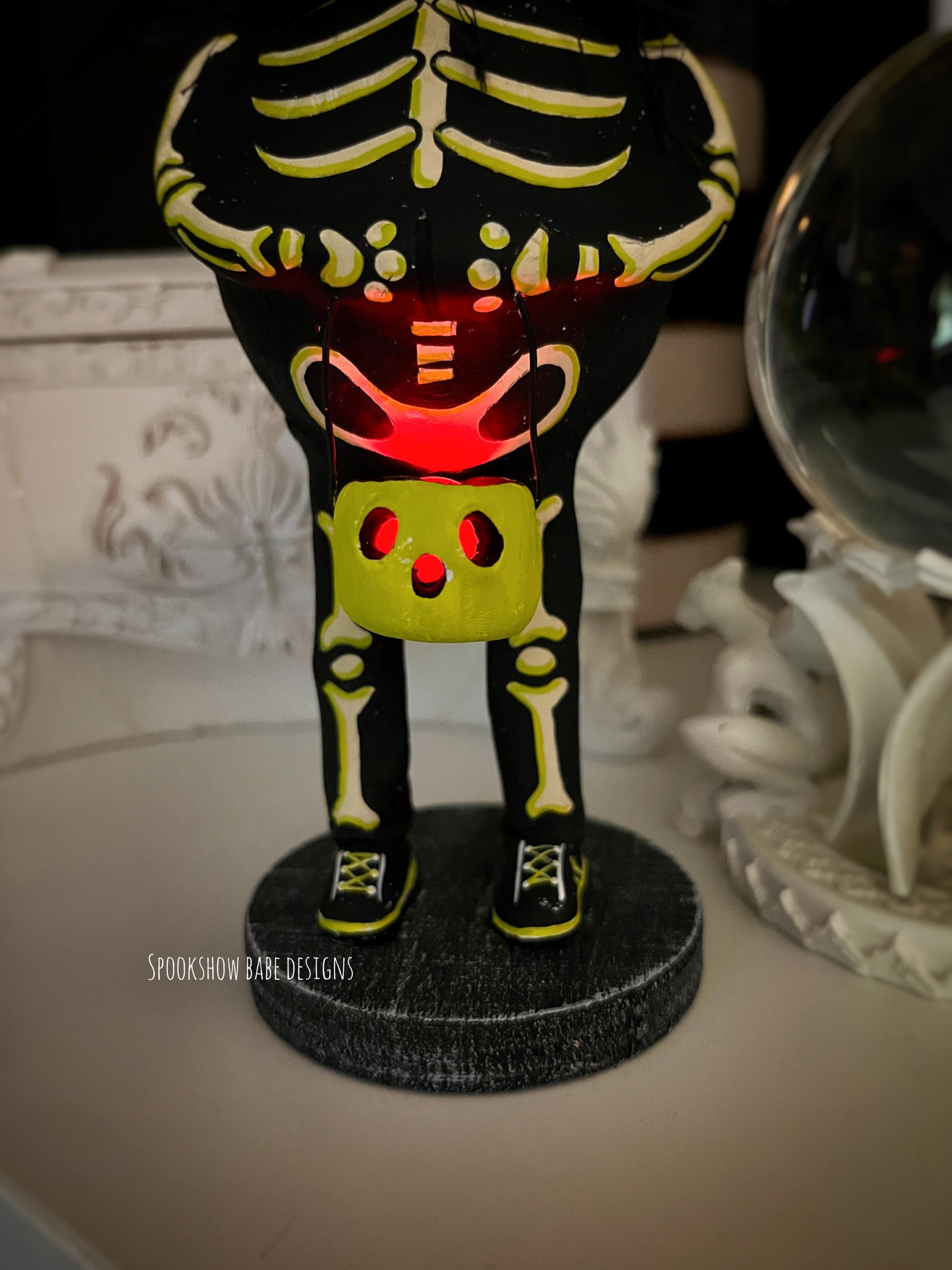 Trick or Treating Skeleton costume Cat with glowing lantern